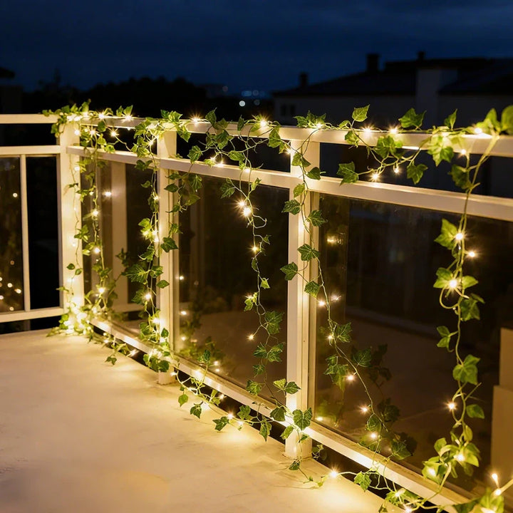 Outdoor decorative warm white LED leaf lights, ideal for pergolas, fences, or garden parties.