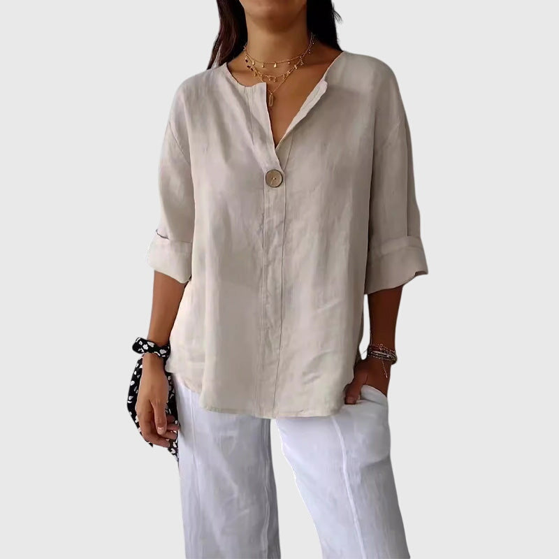 Elegant women's V-neck button-front blouse. Perfect for office or smart casual wear.