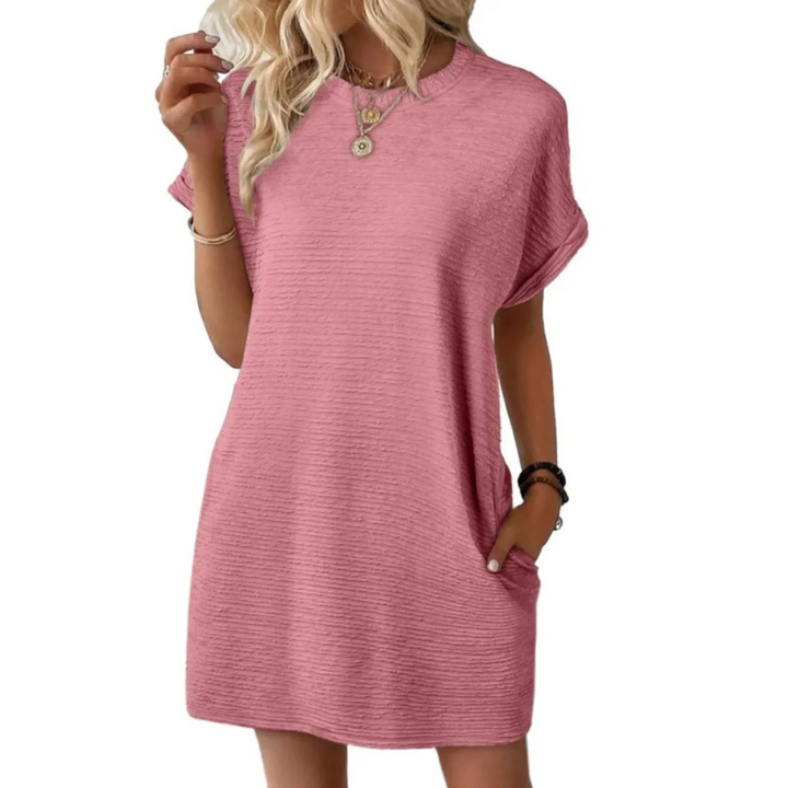 Comfortable women's oversized t-shirt mini dress, short sleeves, round neck. Versatile casual summer outfit with pockets.