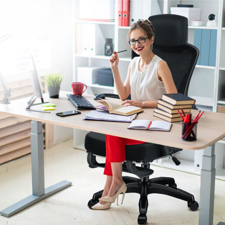 Adjustable ergonomic office chair with recline, footrest & height settings for personalized setup.