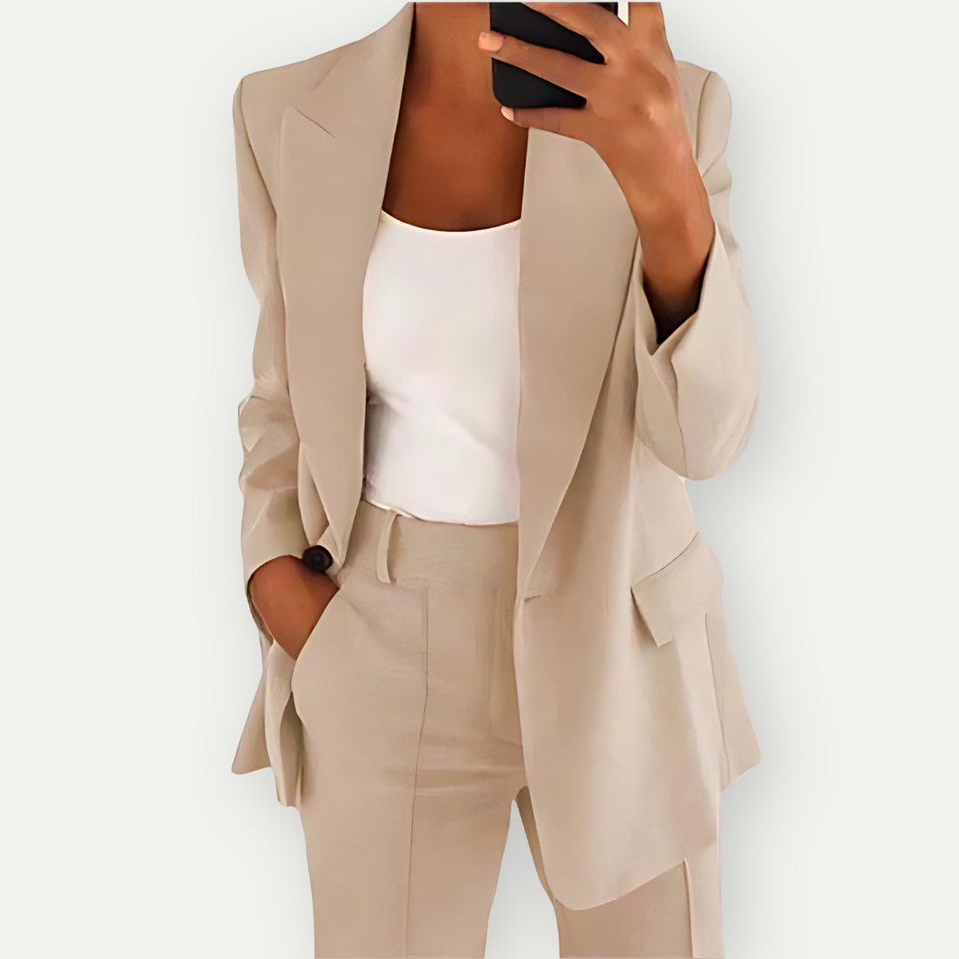 Stylish women's power suit: tailored blazer & trousers for a sophisticated, professional business look.