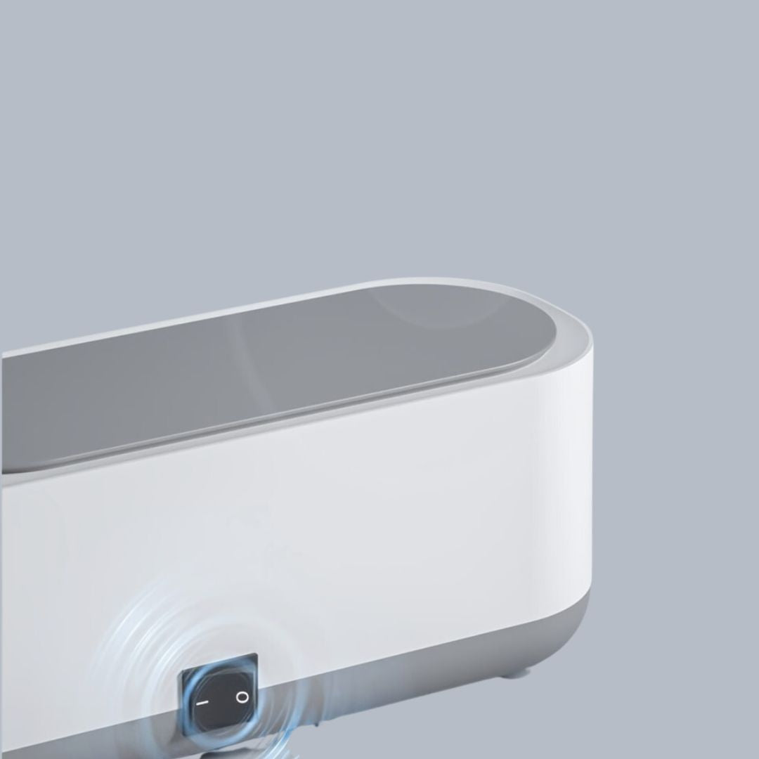 Compact portable ultrasonic cleaner, ideal for personal care, small items & travel hygiene.