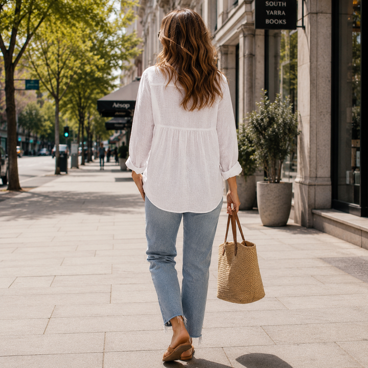 Classic women's button-down long sleeve blouse, a comfortable and versatile collared top for everyday fashion.