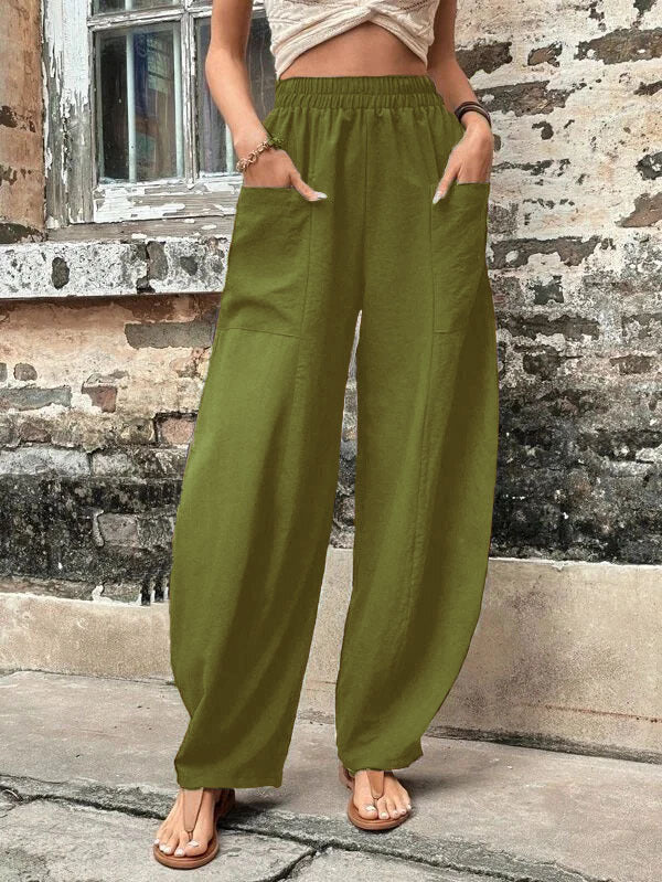 Women's wide-leg trousers, palazzo style, with deep pockets for comfort and essential carrying.