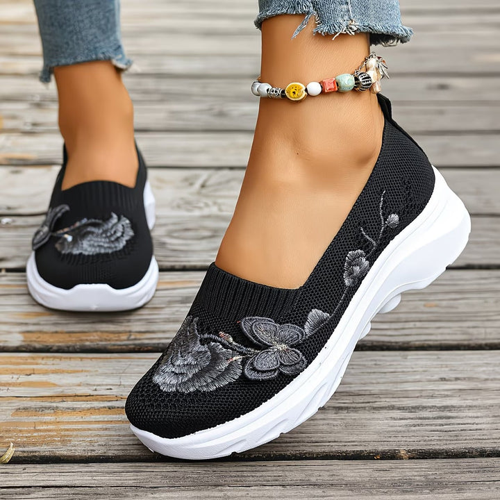 Stylish women's knit slip-on trainers, blending comfort with a modern casual look.