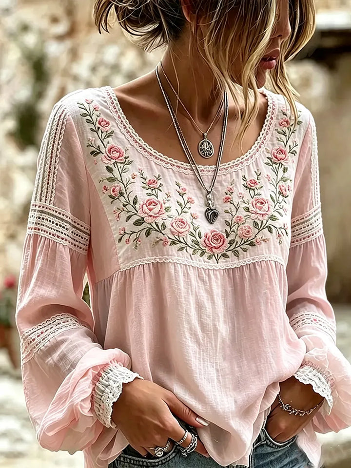 Flowy women's long sleeve top with delicate embroidery, offering a relaxed and comfortable fit.