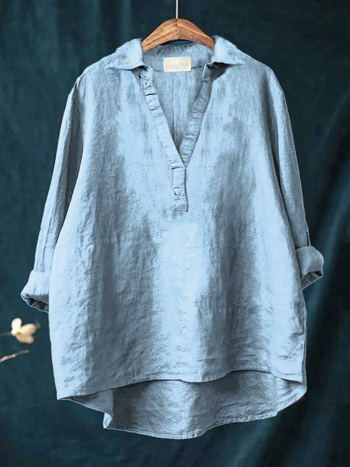 Versatile women's elegant top, long-sleeve button-down blouse suitable for office wear & everyday fashion.