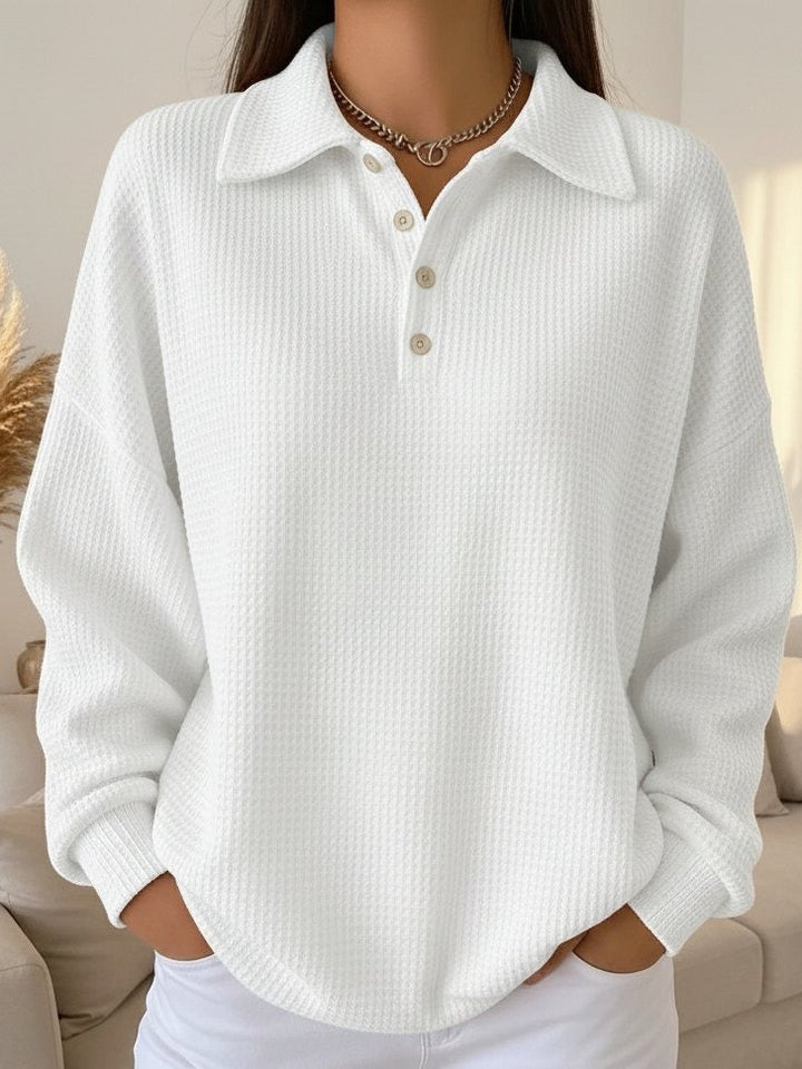 Versatile women's long sleeve waffle knit polo shirt. Relaxed fit casual top for everyday comfort and style.