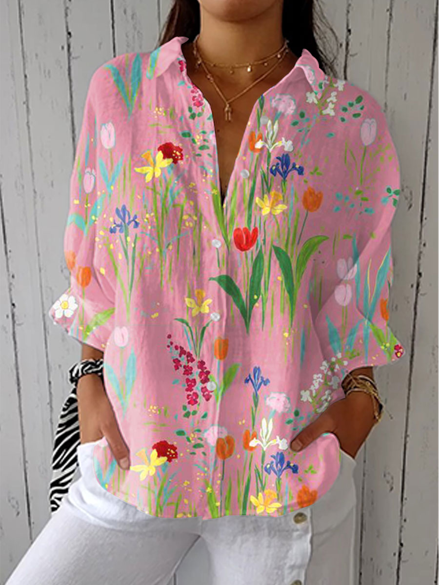 Women's pink spring floral V-neck blouse featuring a vibrant garden print for casual everyday elegance.