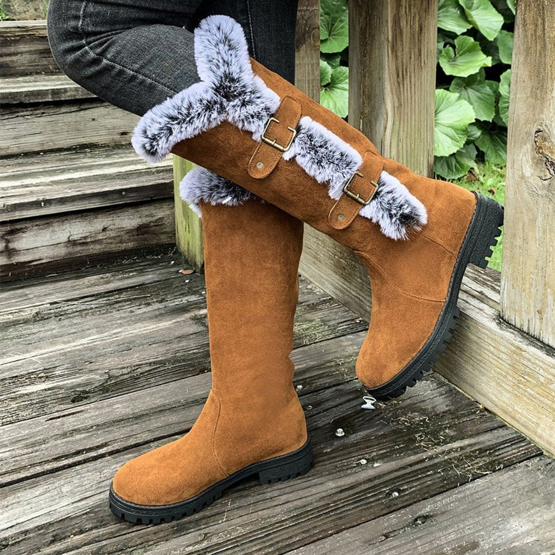 Classic brown women's buckle knee-high boots. Comfortable & tall winter footwear, great for everyday style.