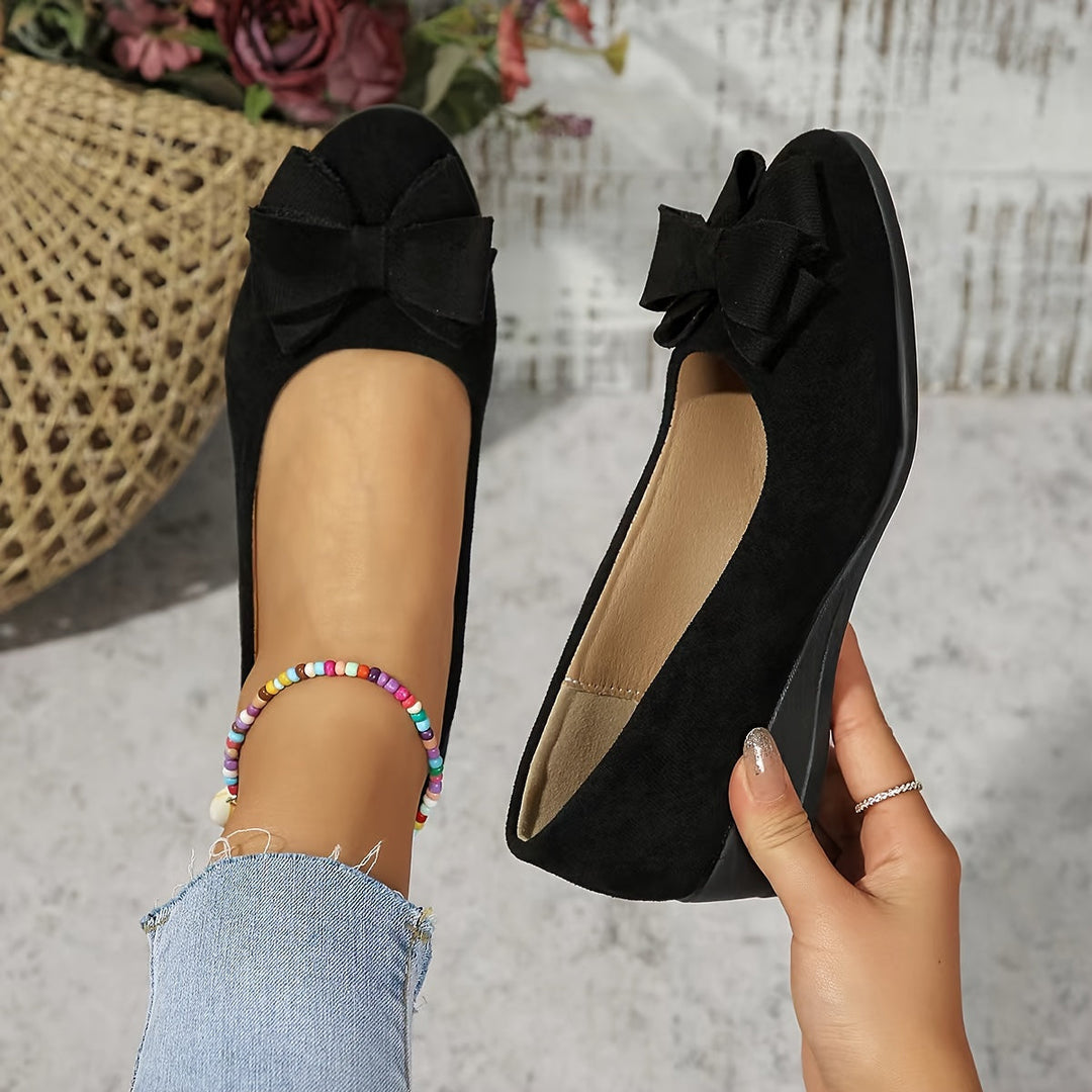 White women's wedge flats with bow, versatile slip-on shoes for elegant and casual daily wear.