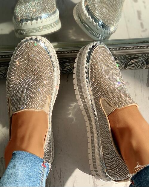 Sparkling women's slip-on shoes with rhinestone and glitter accents, elegant footwear.