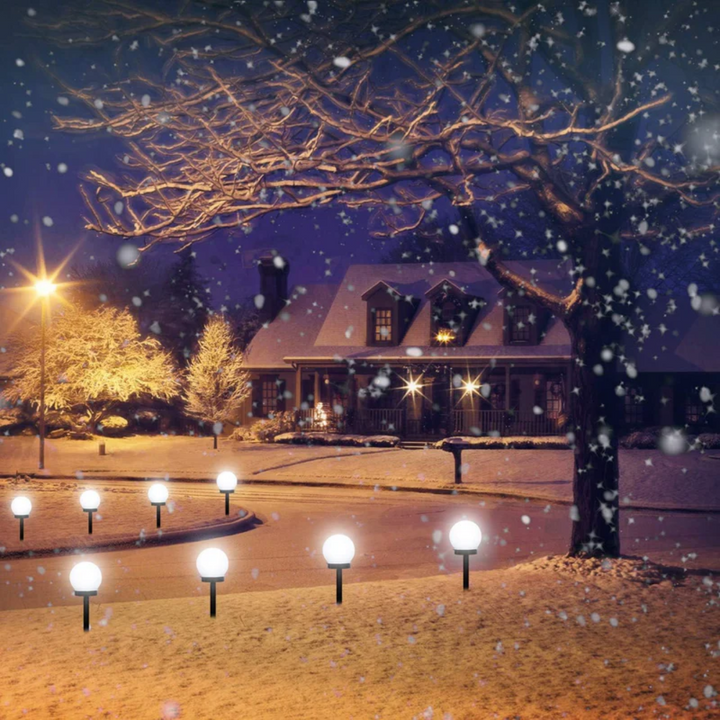 3 waterproof LED solar garden lights, glowing white orbs enhancing outdoor night decor.