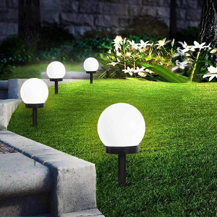 3 SunLuxe LED solar garden orbs, waterproof, for outdoor patio & pathway lighting.