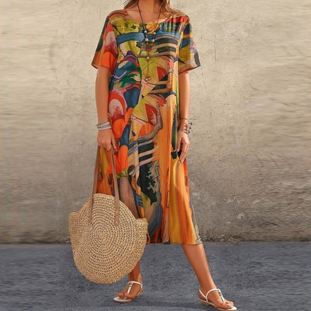Bohemian chic women's relaxed midi dress with unique artistic print & round neck, great for casual summer wear.
