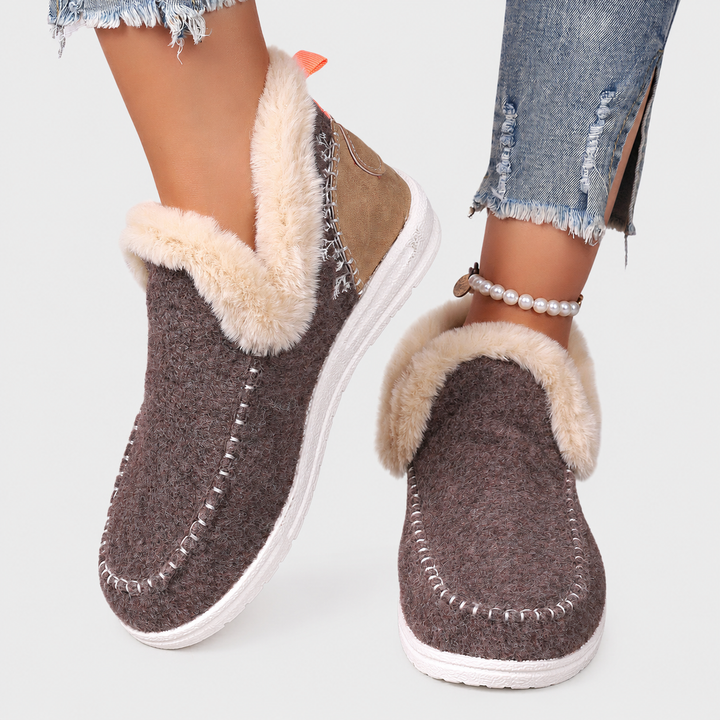 Close-up of heel cushioning on women's orthopedic house slippers. Supportive, cozy indoor footwear comfort.