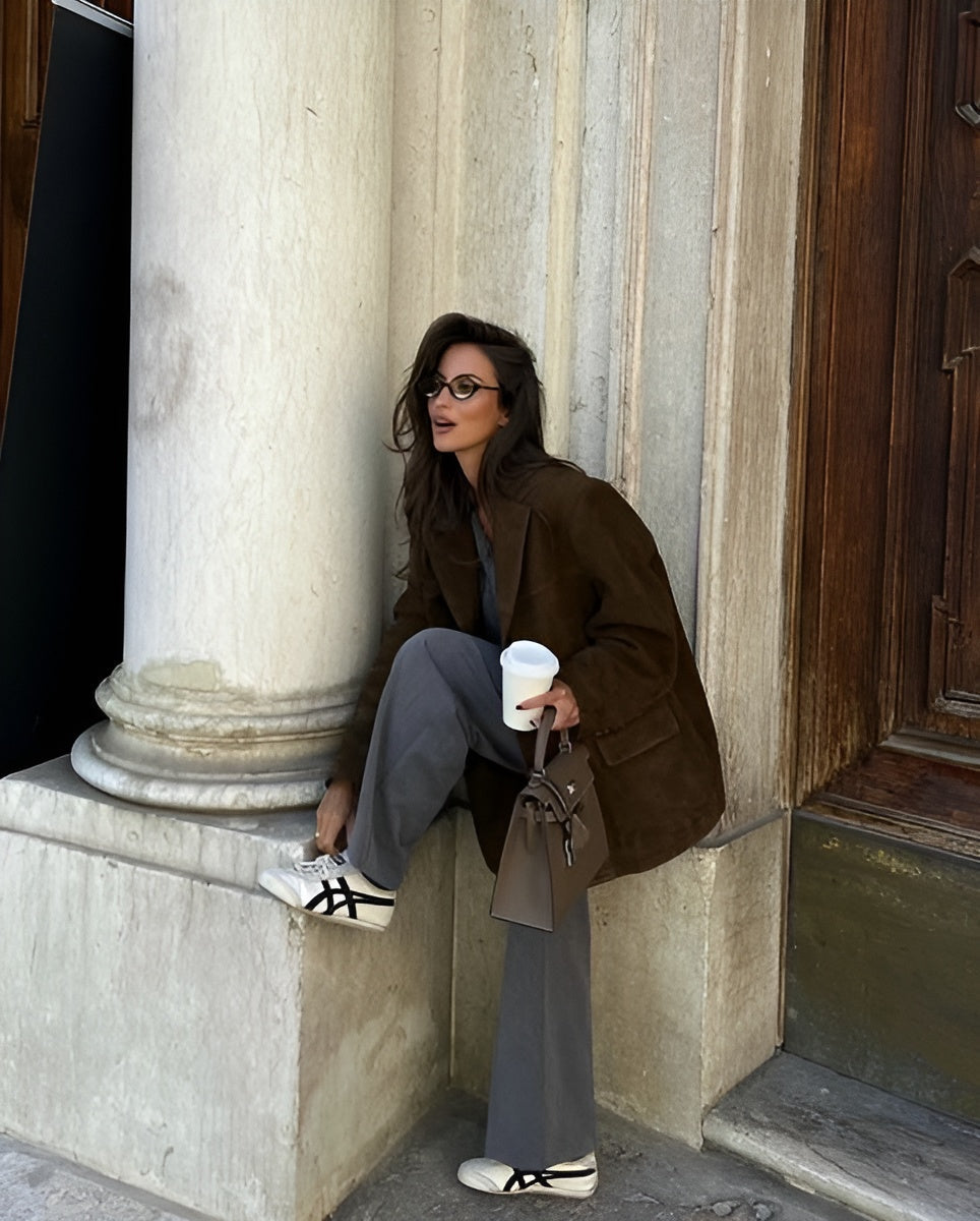 Sophisticated women's one-button blazer. Classic long-sleeve jacket for work or elegant casual style.