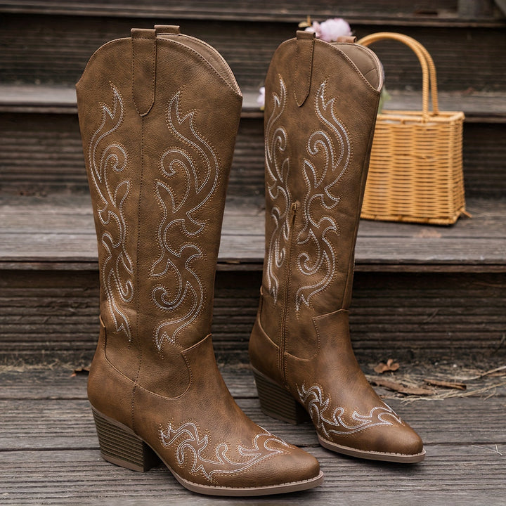 Country chic wide-calf cowboy boots for women. Elegant western stitching, knee-high, block heel.