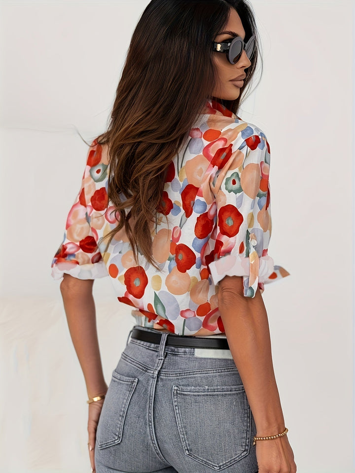 Soft women's long sleeve floral print button-up top with elegant design, ideal for spring/summer fashion.