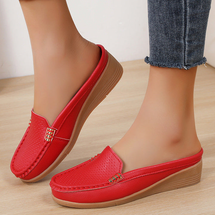Casual women's perforated wedge mules, easy slip-on comfort for spring/summer style.