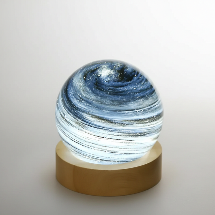 Close-up of a detailed 3D mini planet lamp (SkySphere), showcasing its textured glass surface and soft glow.