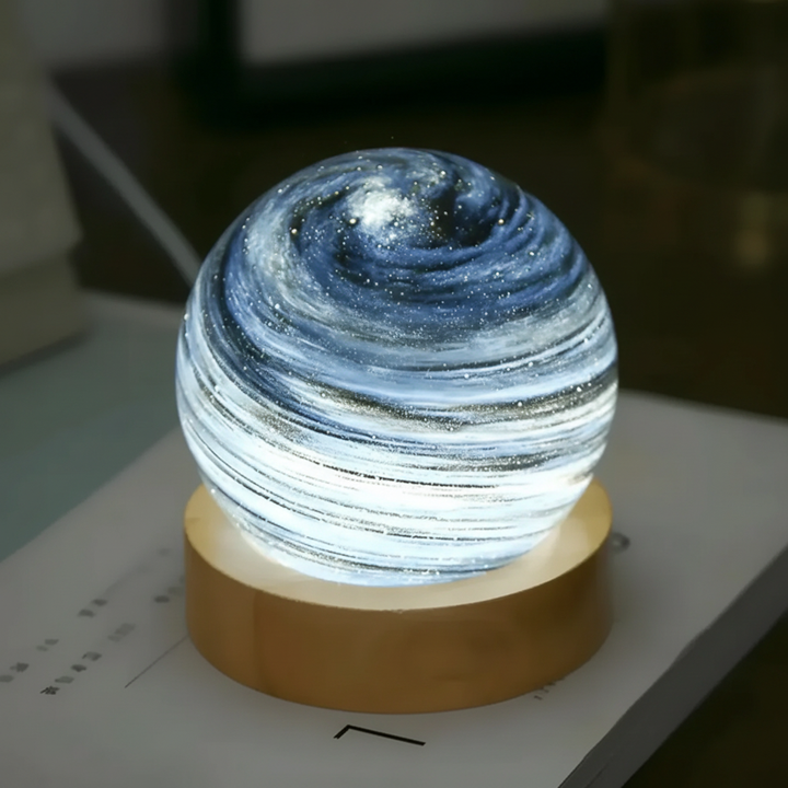 SkySphere 3D mini planet lamp casting a warm, celestial glow, perfect for serene mood lighting on a nightstand.