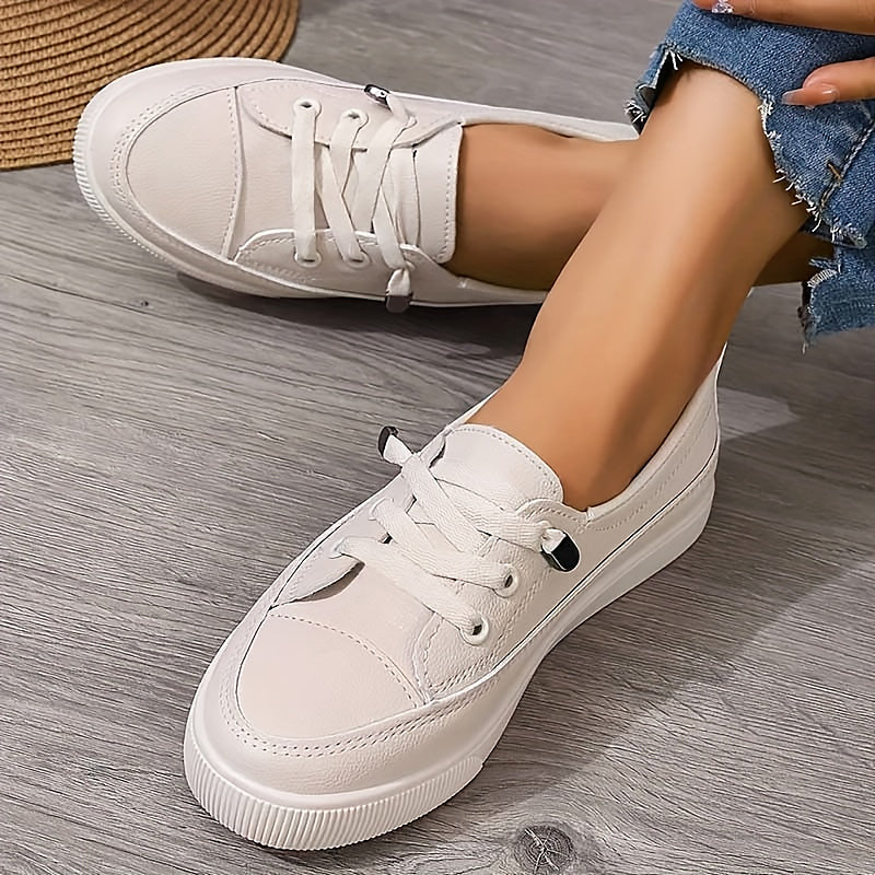 Women's everyday low profile lace-up flat sneakers for casual comfort and versatile style.