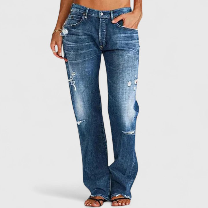 Trendy women's wide leg denim jeans with a comfortable relaxed fit and stylish distressing, perfect for casual wear.