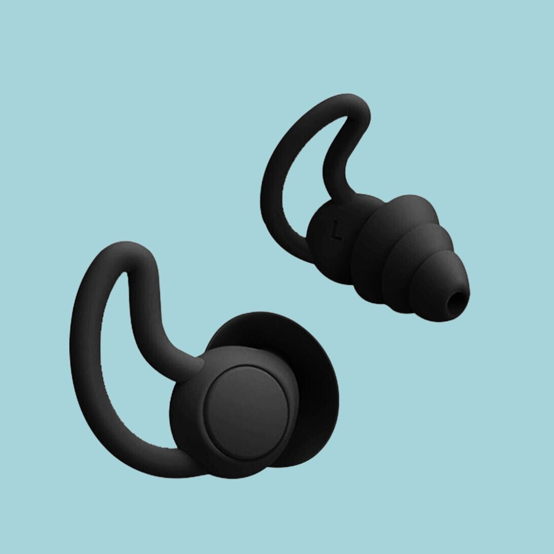 Calming sleep earplugs shown on a bedside table, promoting peaceful sleep.