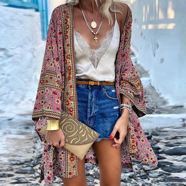 Bohemian chic women's patterned knit cardigan, colorful fashion layering piece. Trendy Elara style.