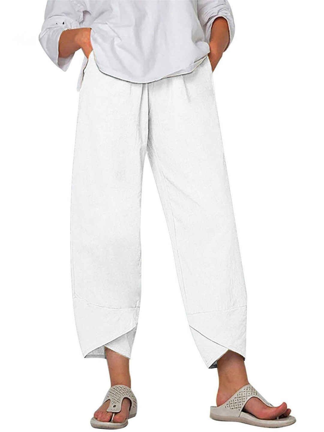 Close-up of breathable linen fabric on women's loose fit harem trousers, wide leg casual pants.