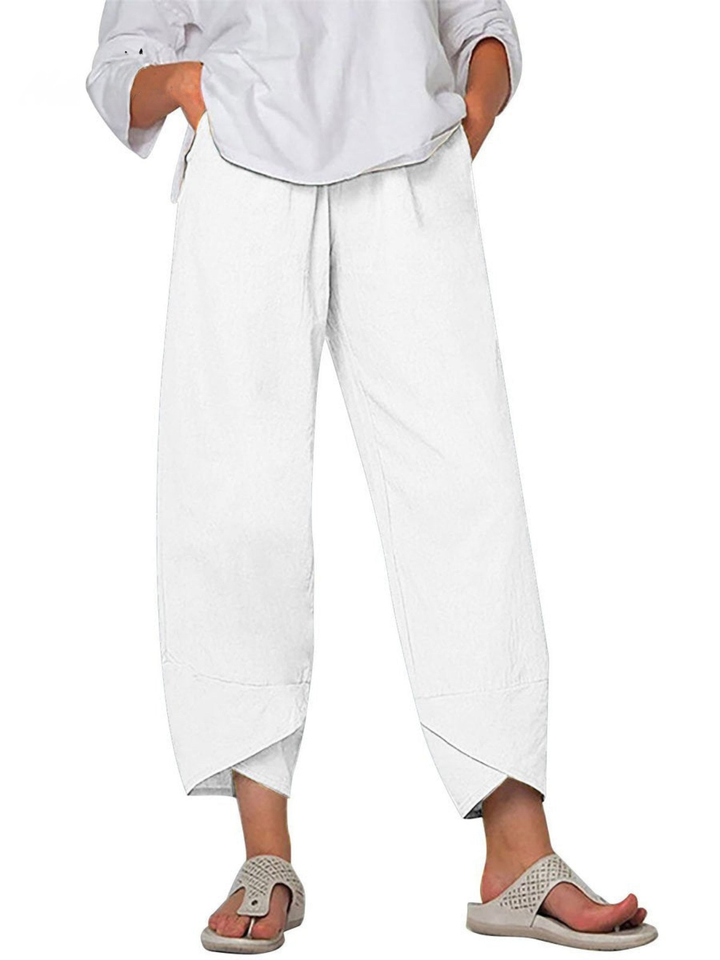 Close-up of breathable linen fabric on women's loose fit harem trousers, wide leg casual pants.