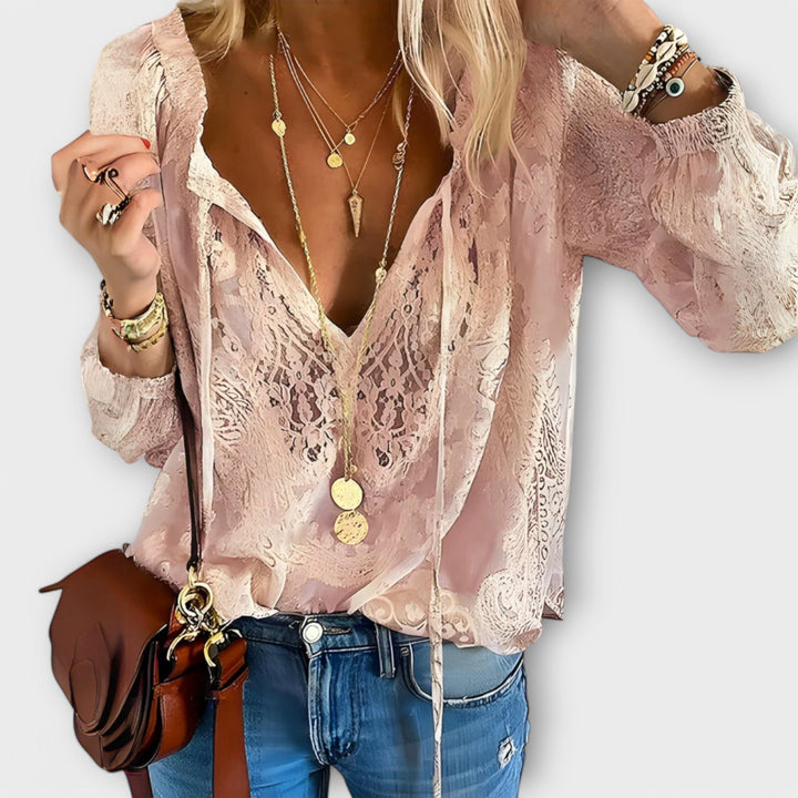 Sophisticated women's lace overlay blouse, V-neck, and delicate tie front, an elegant fashion top.