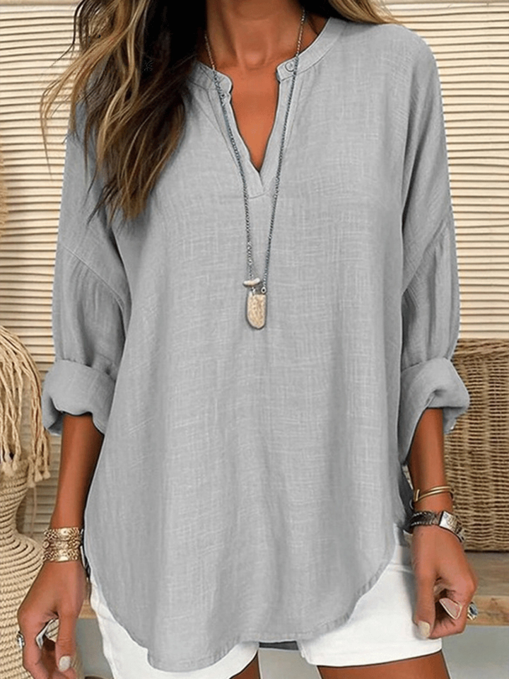Versatile women's long sleeve V-neck blouse. Relaxed fit tunic for effortless layering.