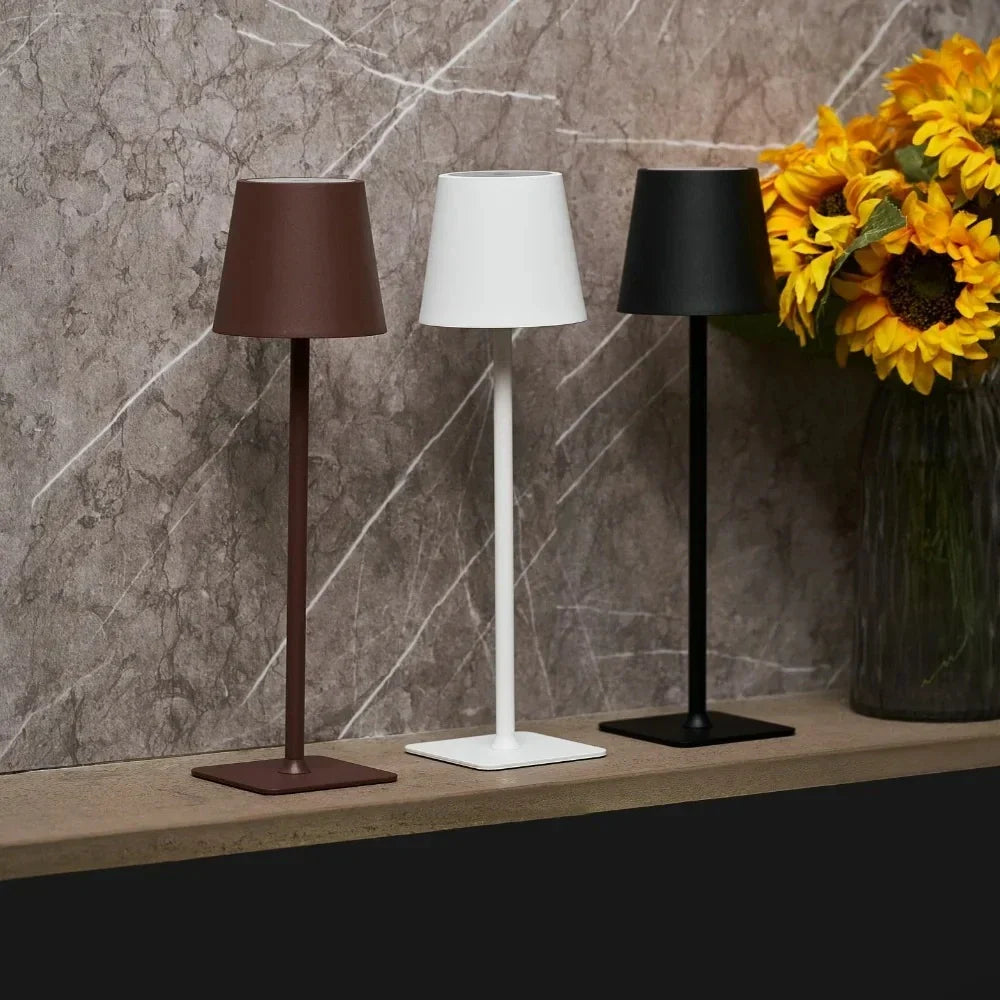Modern dimmable LED table lamp for indoor & outdoor use. Rechargeable & portable ambiance light.