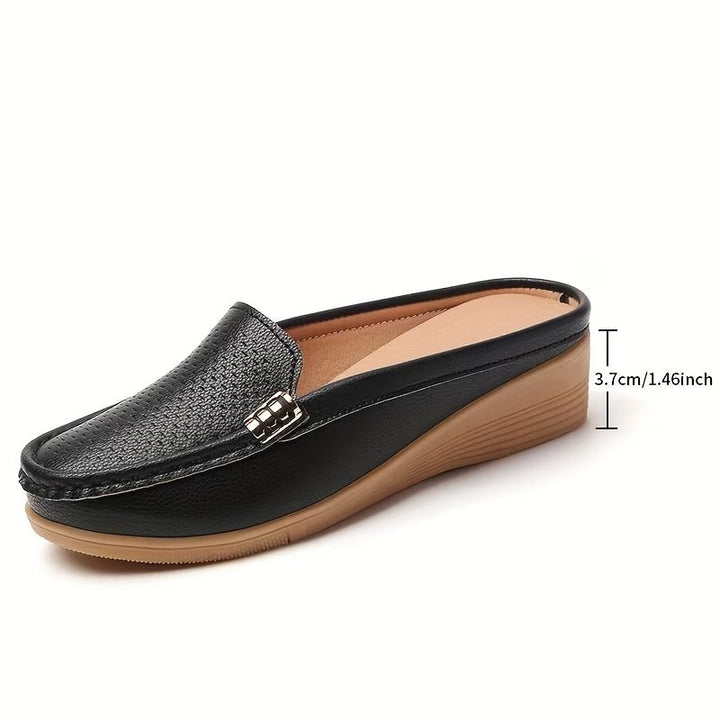 Versatile women's wedge mules, a comfortable slip-on sandal for spring and summer.