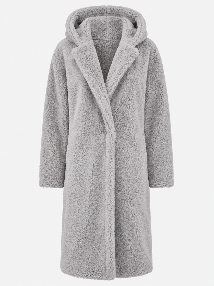 Cozy women's hooded coat, knee-length, perfect for staying warm and elegant in winter.