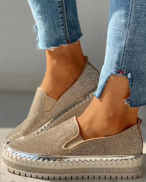 Sparkly women's slip-on slippers with rhinestone accents, ideal for comfort and fashion.