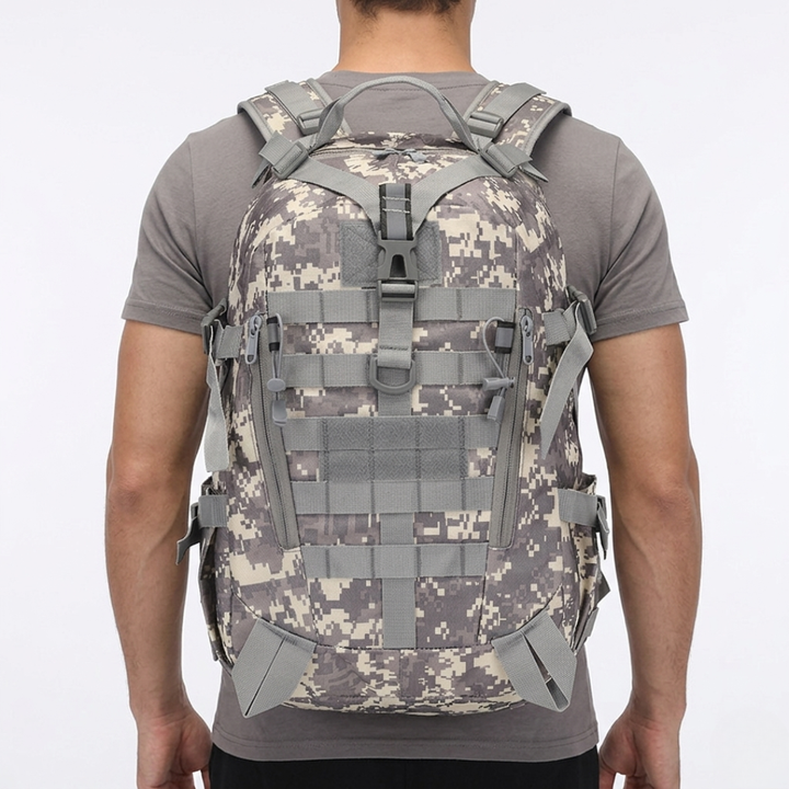 Interior of 10 gallon tactical backpack, spacious compartments for outdoor gear, durable & waterproof.