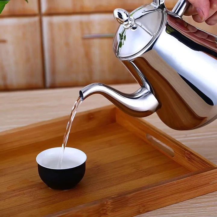 Durable stainless steel electric kettle features a filter & rapid boil for convenient hot beverages.