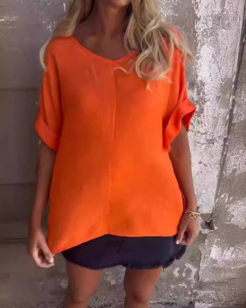 Women's effortless V-neck casual top, a comfortable half-sleeve shirt for loose fit summer fashion and everyday wear.