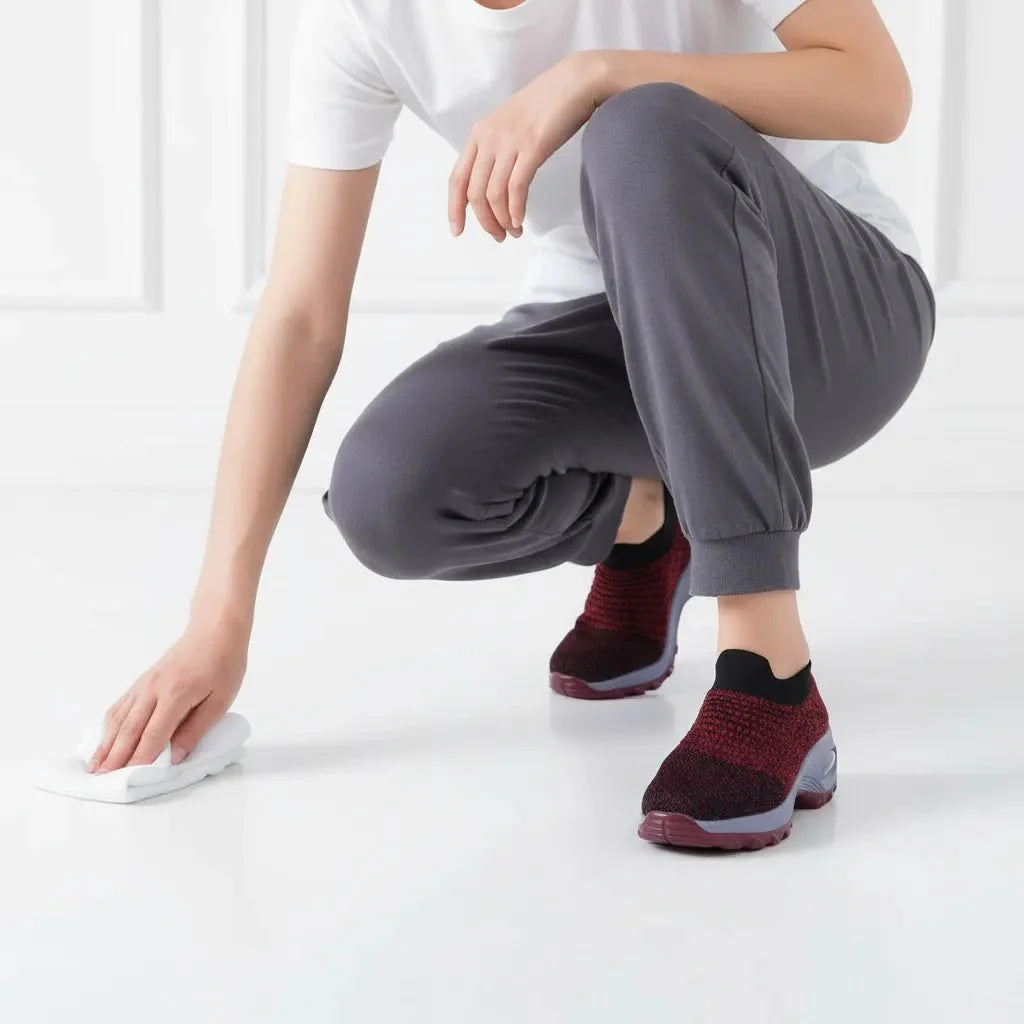 Women's Red walking sneakers with strong arch support, slip-on design for easy wear.