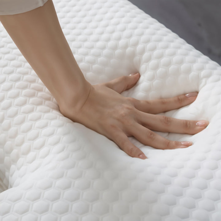 Cuddle pillow for side sleepers, features contouring memory foam for neck and shoulder comfort.