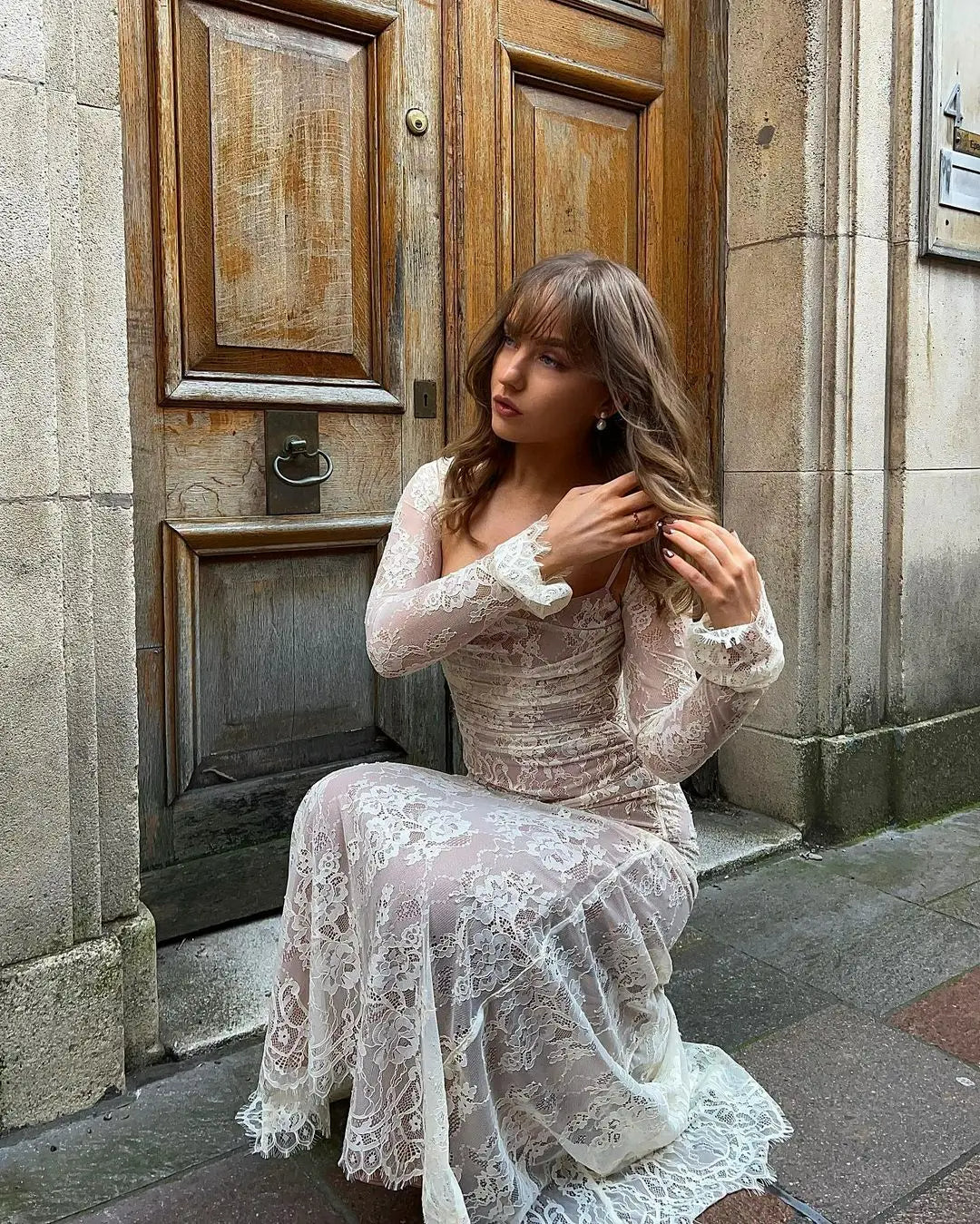Full-length view of an elegant women's lace maxi dress, perfect as a formal evening gown for special occasions.