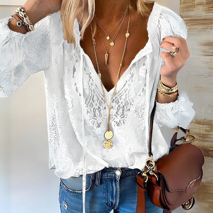 Boho chic women's lace V-neck blouse, relaxed fit, perfect for stylish summer and casual occasions. Feminine topwear.