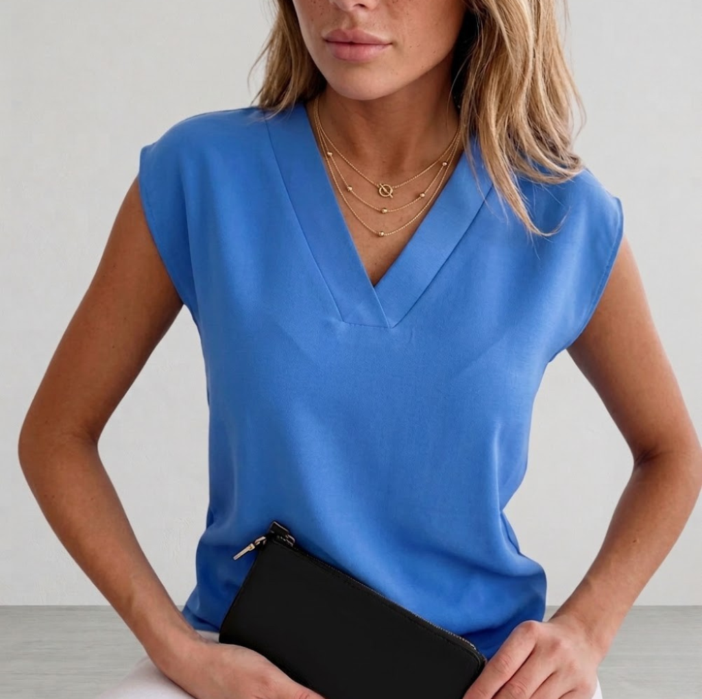 Elegant women's V-neck sleeveless blouse, perfect for workwear or a stylish casual look. Versatile summer fashion top.