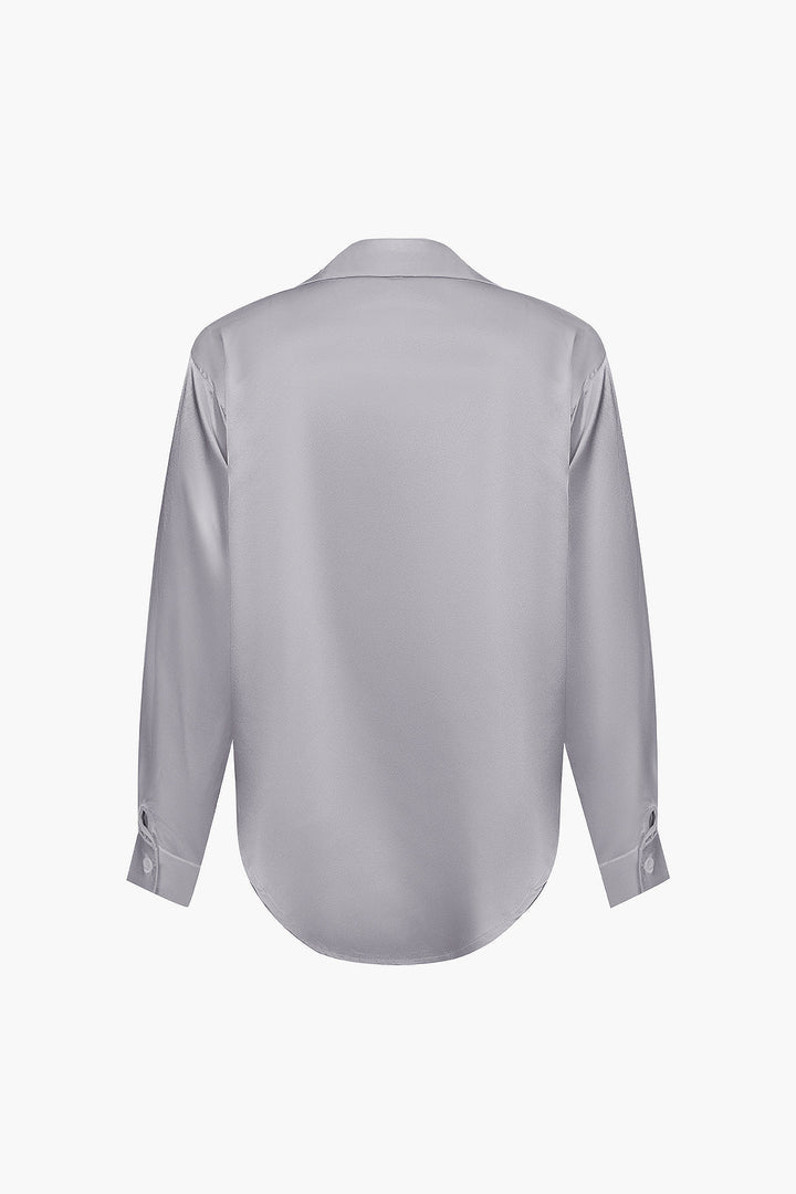 Flattering women's long-sleeve button-down shirt, an elegant and chic style.