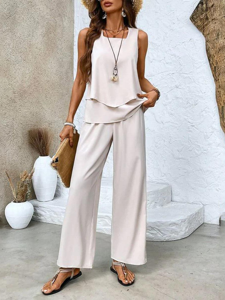 Women's warm weather cotton blend outfit. Sleeveless top paired with wide leg pants for a chic, casual look.