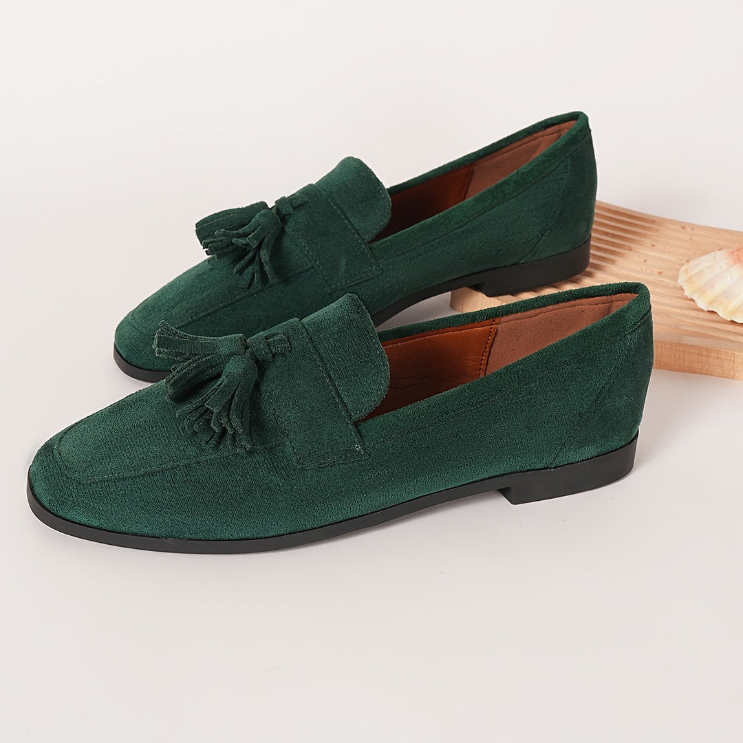 Green tassel loafers for women, blending casual comfort with elegant slip-on convenience.