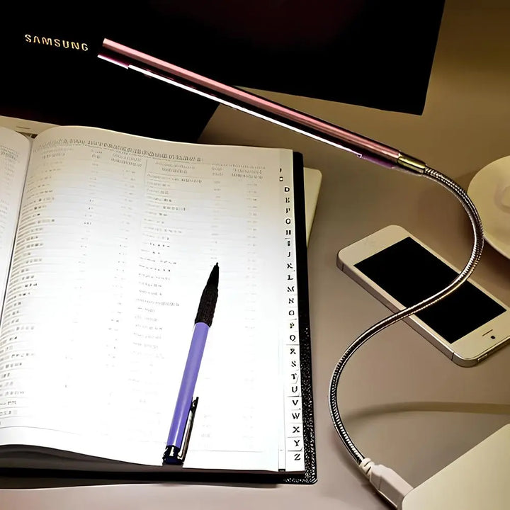 Portable USB gooseneck light, dimmable LED for keyboard & reading tasks.